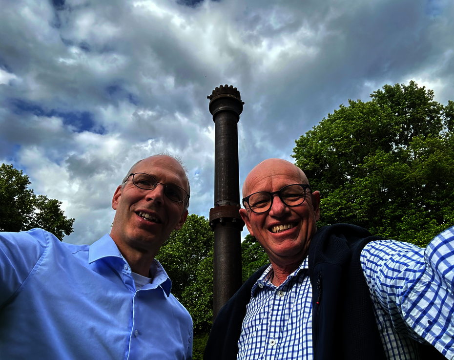 Markus Schmid from BASF and Durell Hammond from Tanuki in front of the original ammonia reactor in Germany.