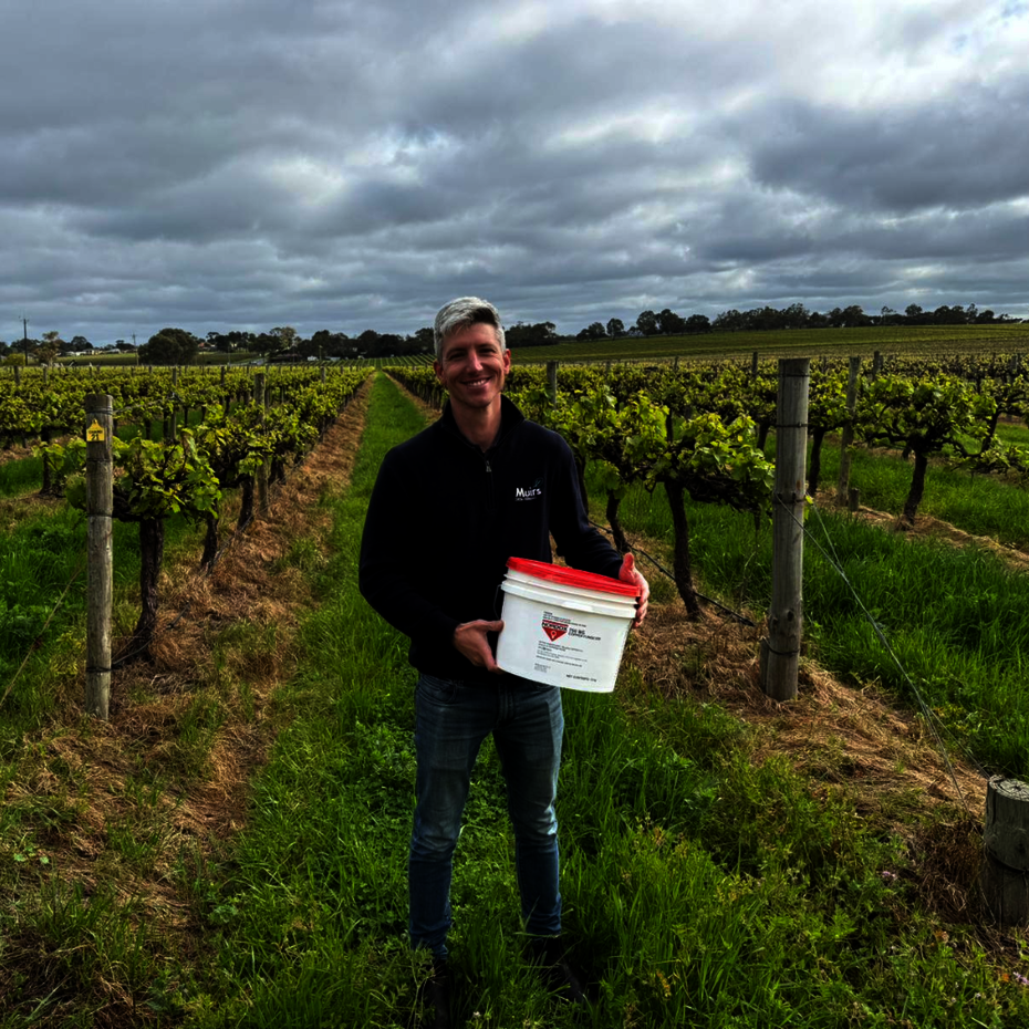 Muirs representative holding a Nordox pail